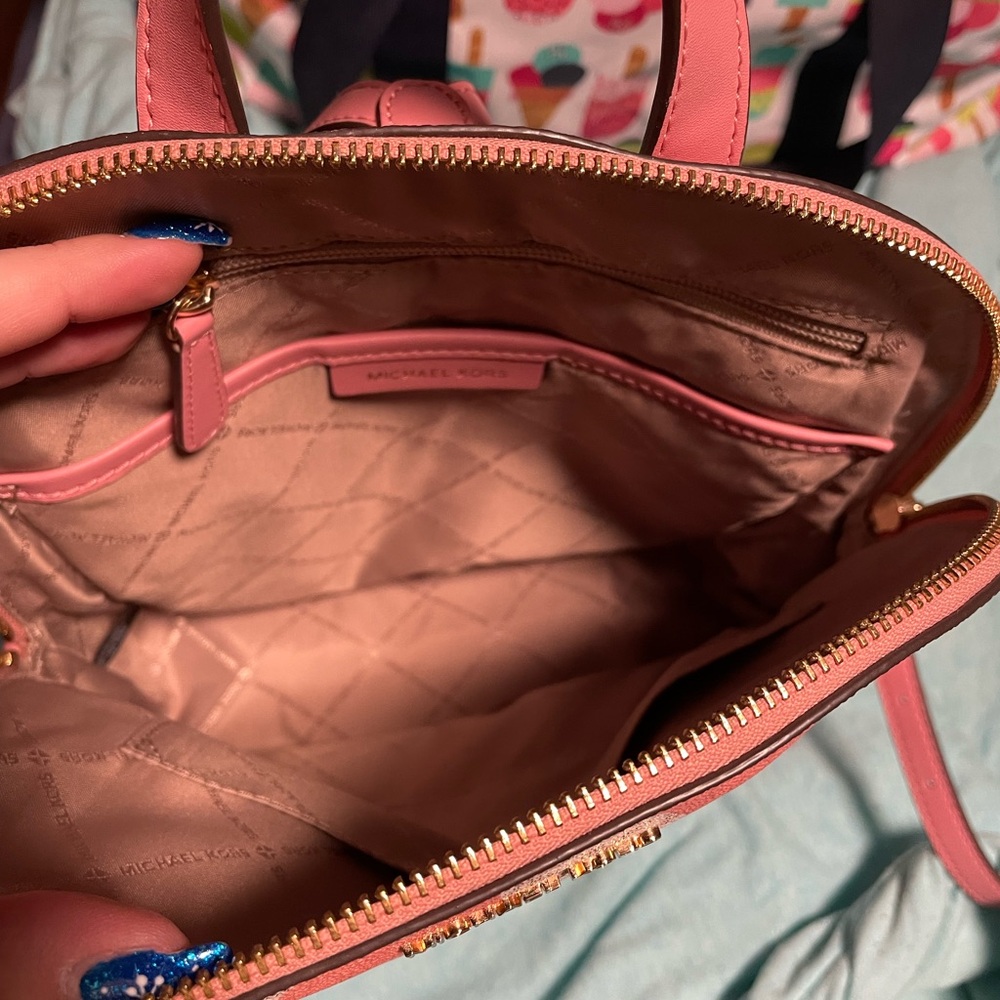 Michael Kors Pink and cream backpack.